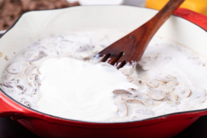 Making a creamy mushroom sauce.