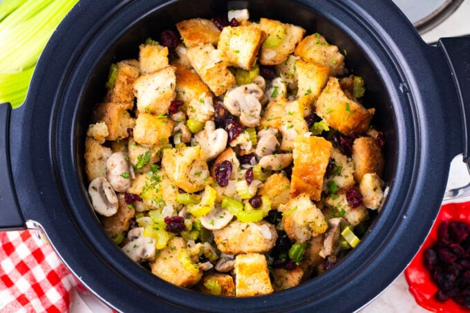 Overhead shot of stuffing with cranberries and veggies in the crockpot.