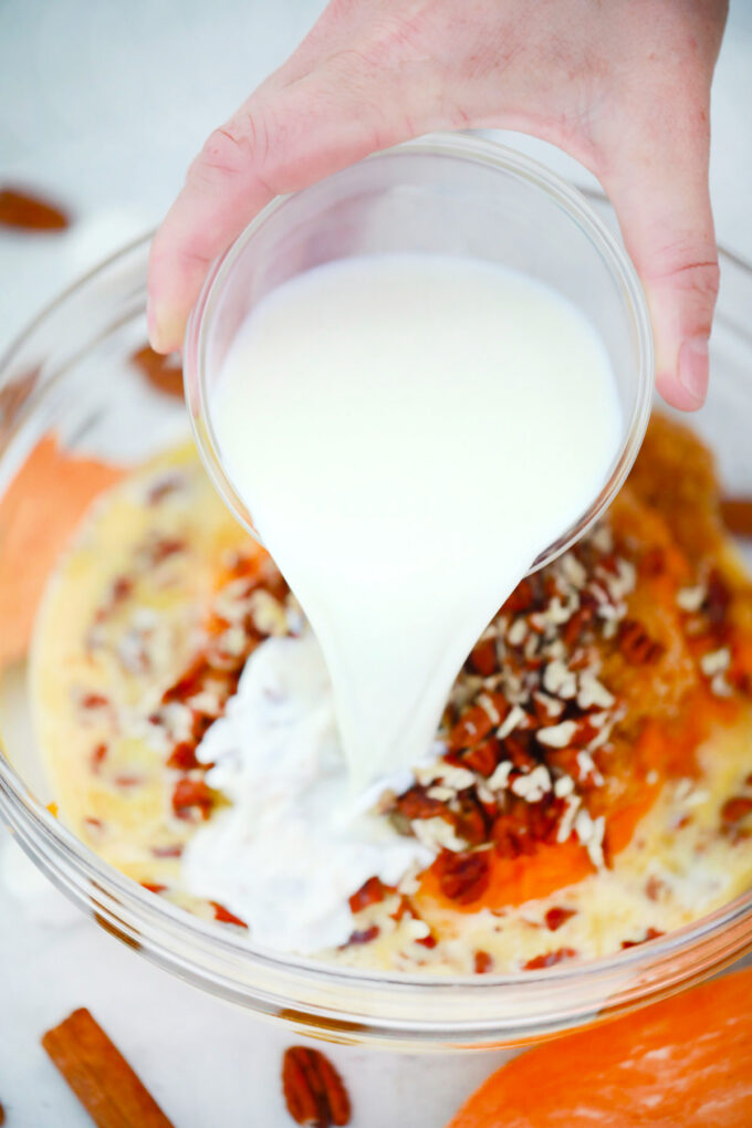 Sweet potato casserole ingredients in a bowl.