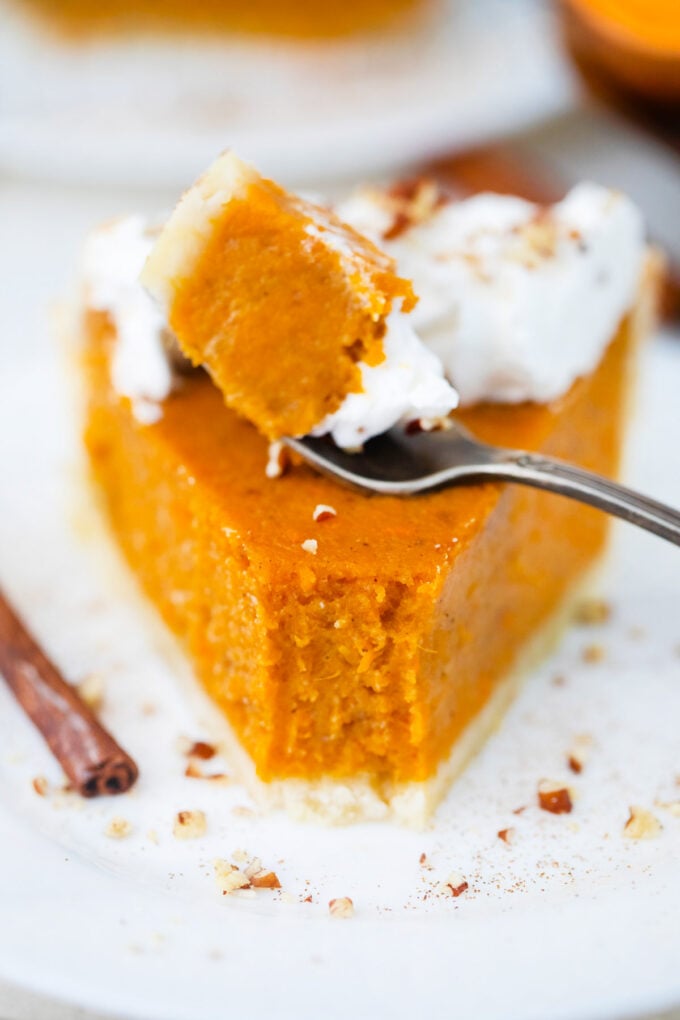 A forkful of creamy sweet potato pie.