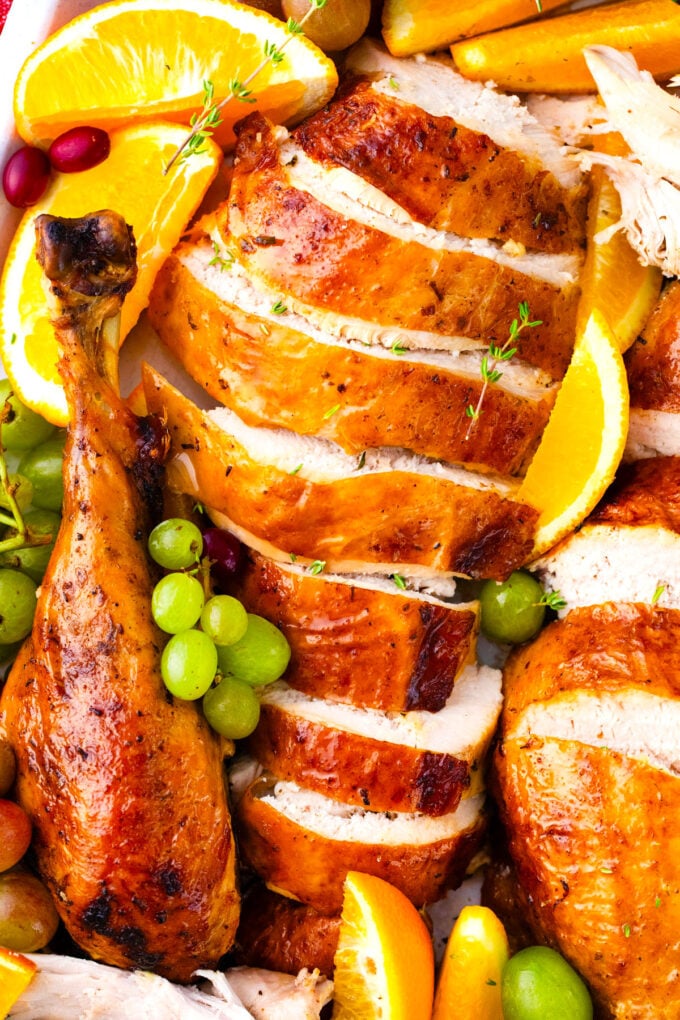 Homemade, sliced, tender oven roasted turkey with crispy sin.