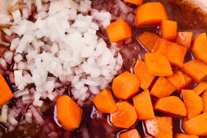 Homemade beef Bourguignon ingredients in a Dutch oven.