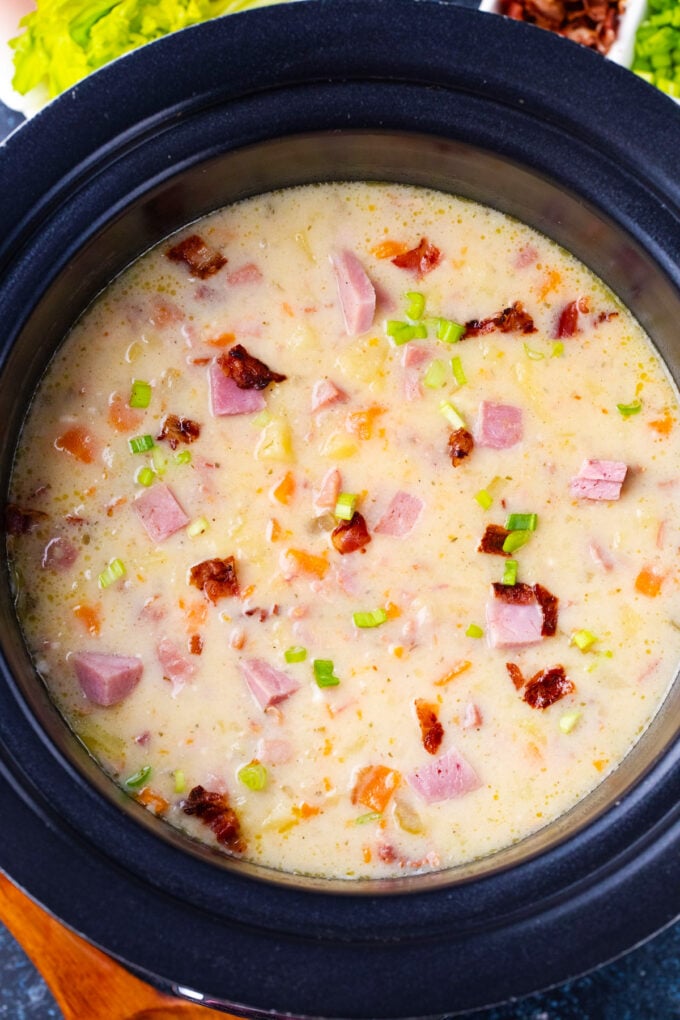 Overhead shot of crockpot ham and potato soup.