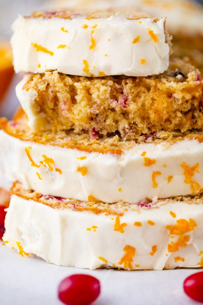 Slices of cranberry bread with orange zest.