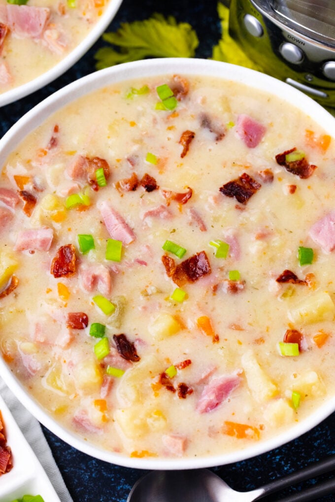 Homemade slow cooker ham and potato soup with bacon.