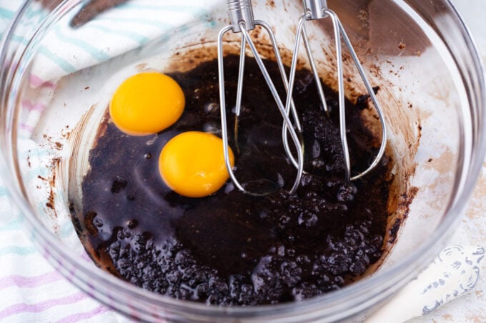 Mixing wet ingredients for chocolate crinkle cookies.