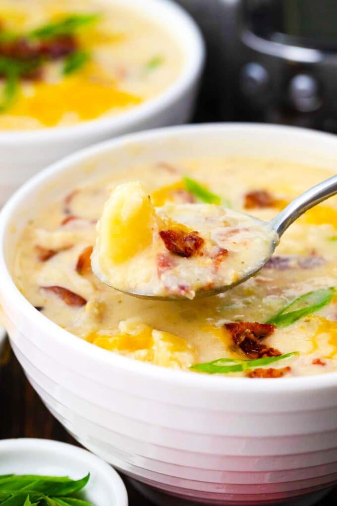 a spoonful of creamy slow cooker baked potato soup