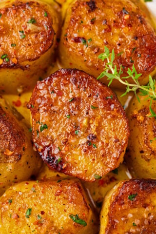 Close shot of perfectly browned fondant potatoes.