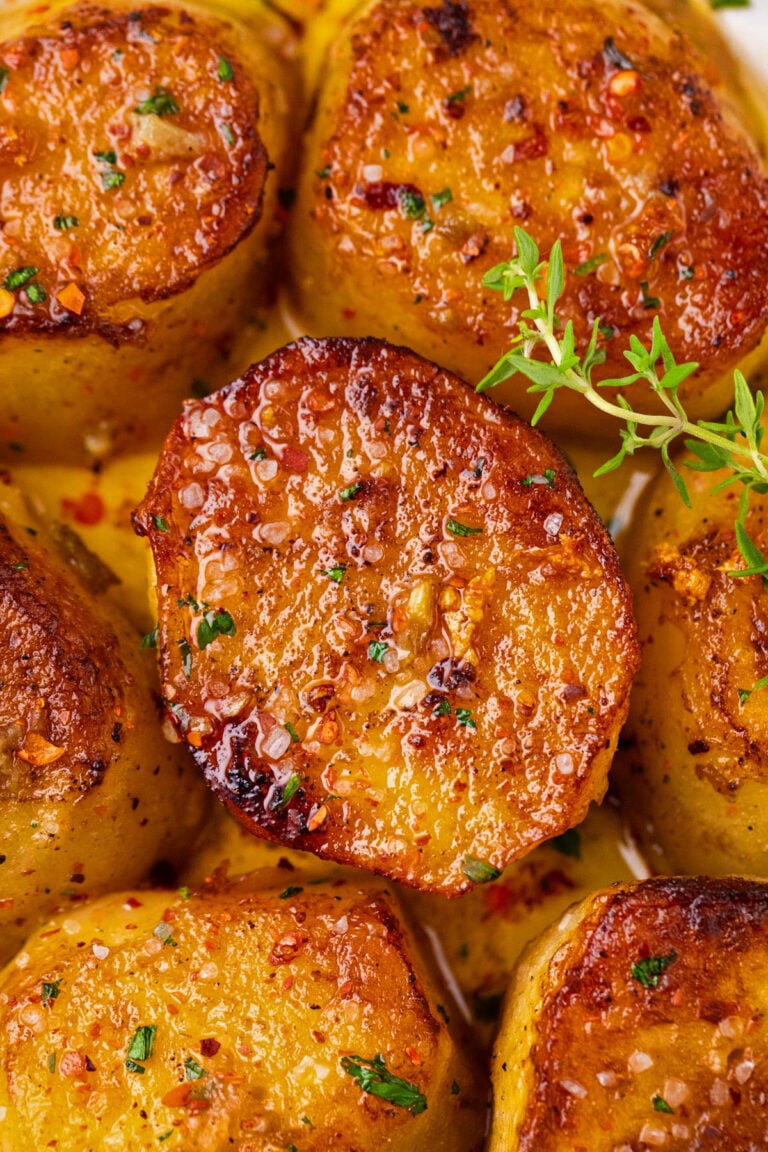 Close shot of perfectly browned fondant potatoes.