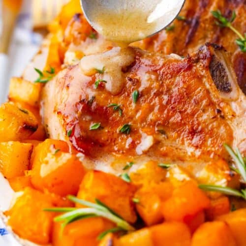 pouring maple mustard dressing over juicy apple pumpkin pork chops