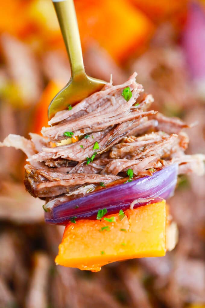 A forkful of tender pumpkin pot roast.