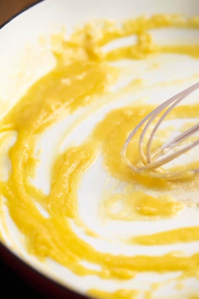 stirring a butter and flour roux in a skillet