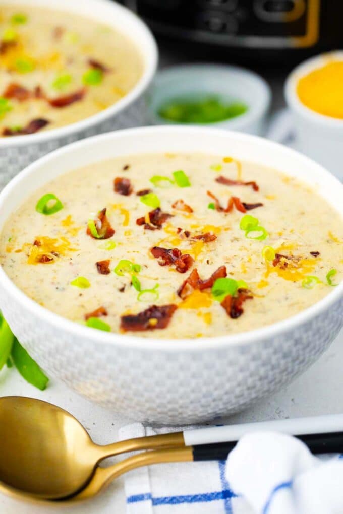 a bowl of creamy crockpot bacon ranch potato soup