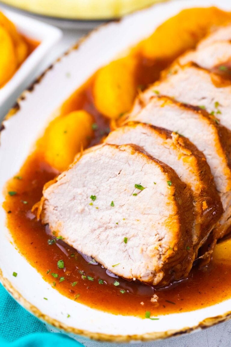 Slow cooker peach pork in sweet and savory peach cgalze.