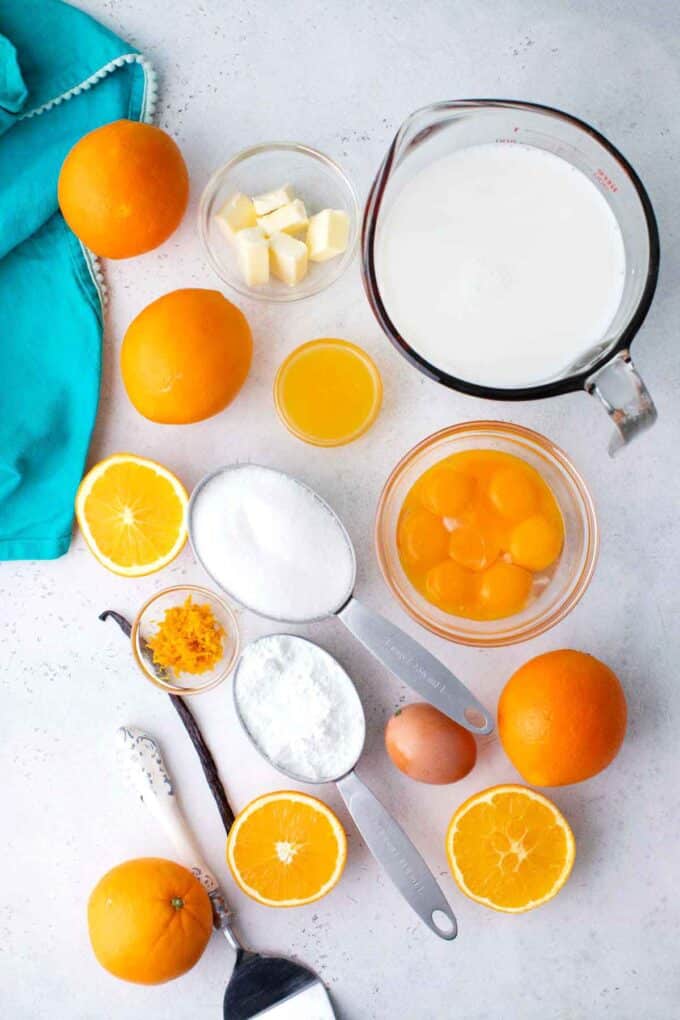 orange custard ingredients in bowls on a table