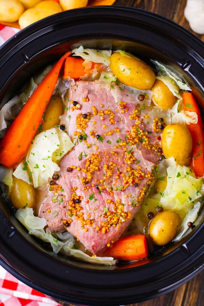 Overhead shot of slow cooker corned beef and veggies.