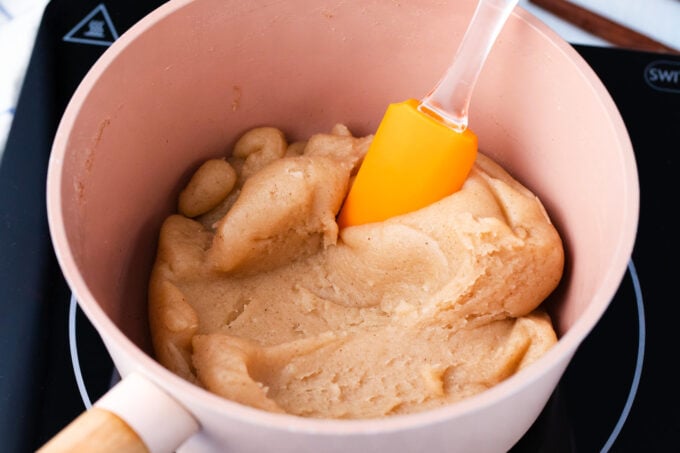 Churros dough in a saucepan.