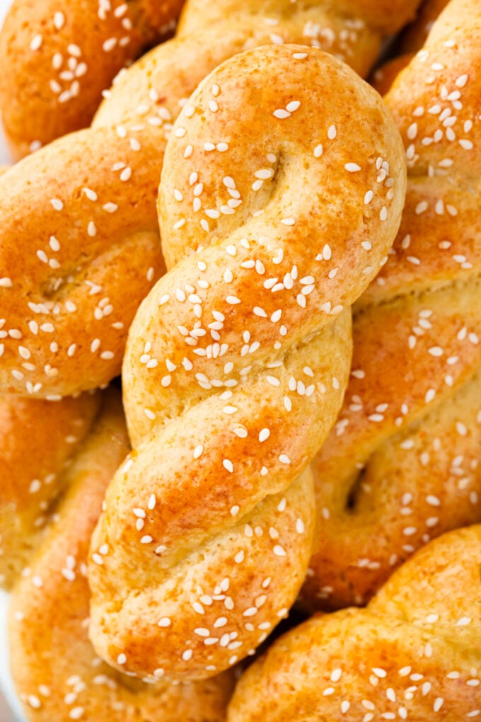 Close shot of Easter Greek Cookies Koulourakia topped with sesame seeds.