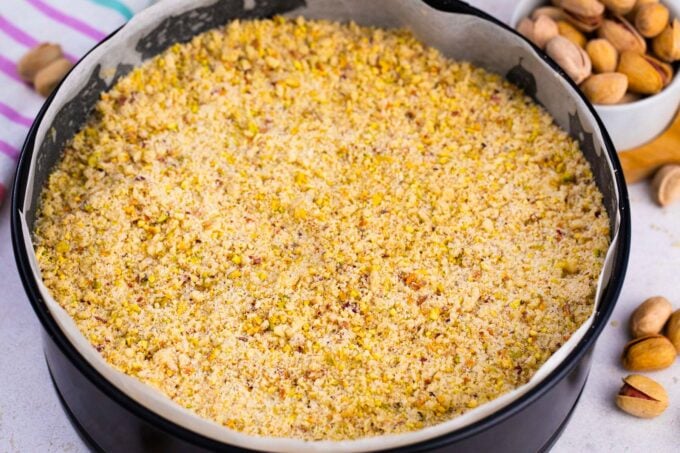 Pistachio coffee cake in a springform pan before baking it.