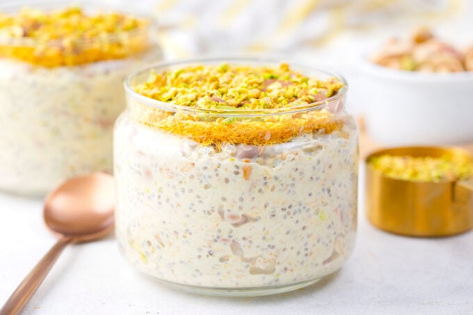 Two jars of Dubai chocolate overnight oats.