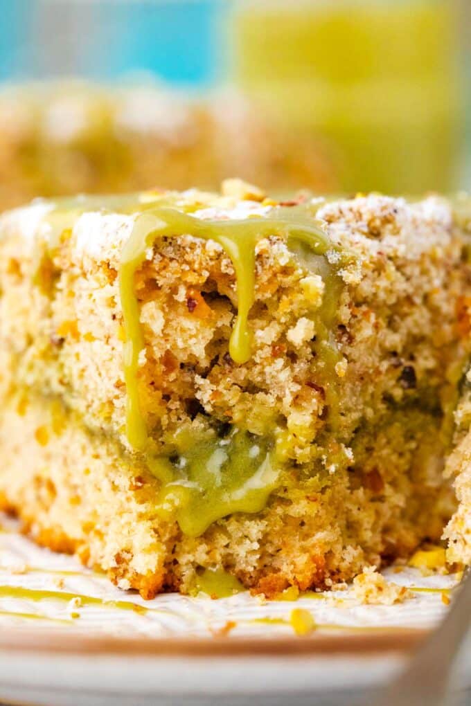 Close shot of a slice of pistachio coffee cake.