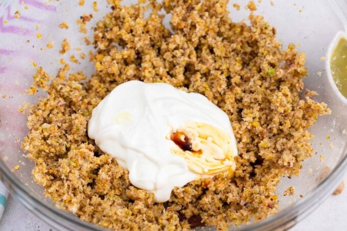 Pistachio spread and yogurt in a bowl.