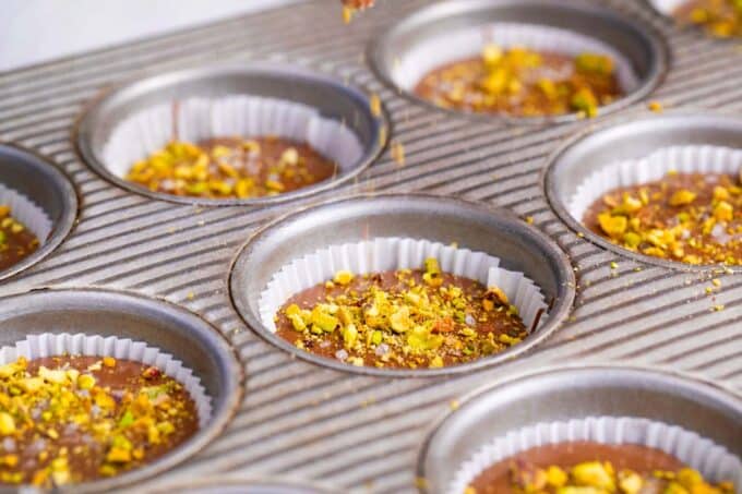 Dubai chocolate pistachio cups in muffin tins.