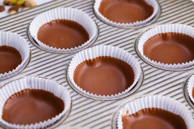 melted chocolate in muffin liners.