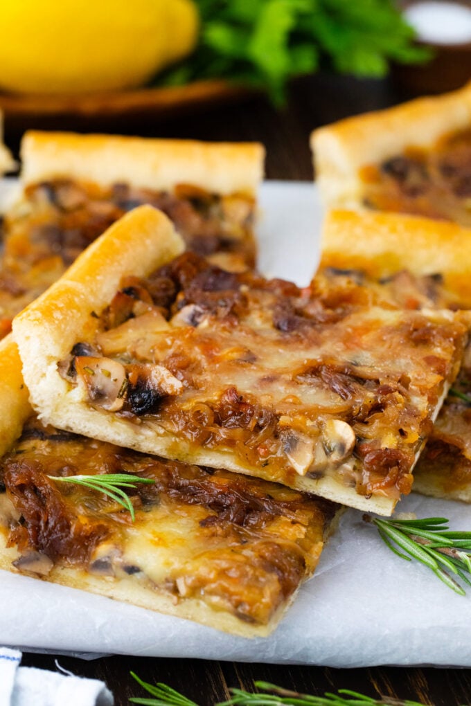 A slice of puff pastry caramelized onion tart.