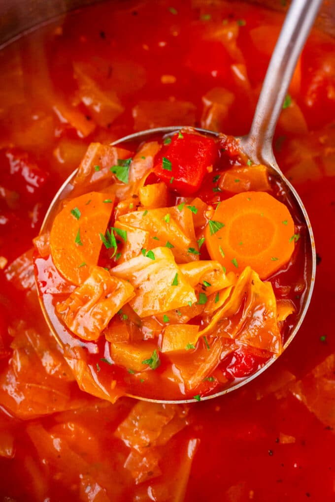 A ladle of Instant Pot Cabbage Soup.