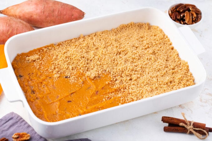 Adding cinnamon streusel layer to sweet potato casserole.
