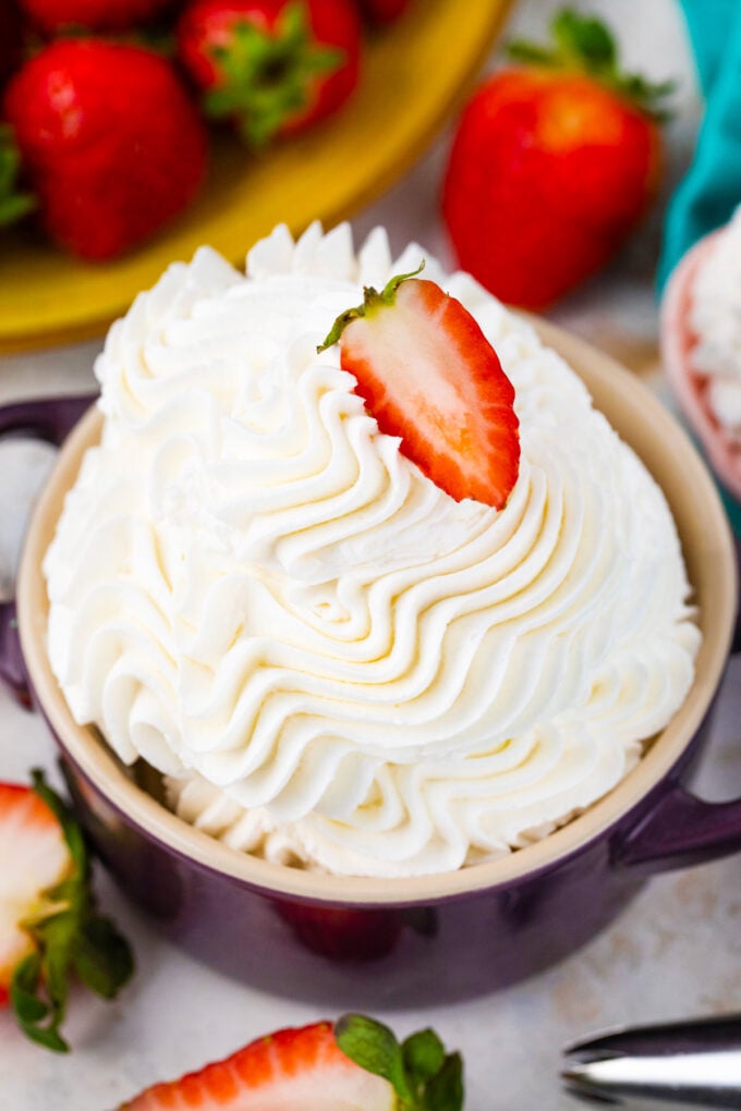 A bowl of swirled stabilized whipped cream.