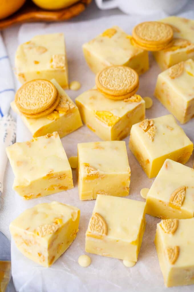 Lemon Oreo fudge squares on a cutting board.