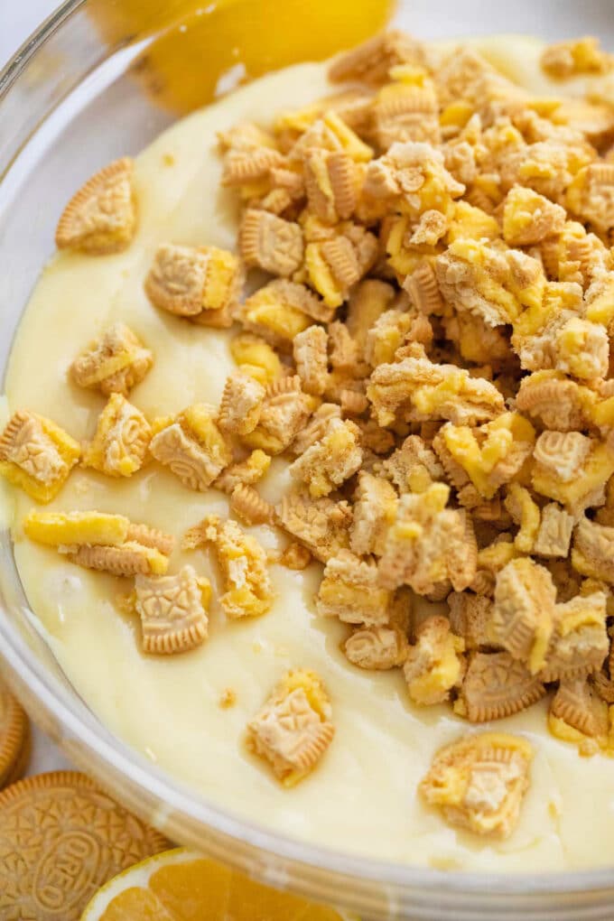 Adding chopped Lemon Oreos to white chocolate fudge.