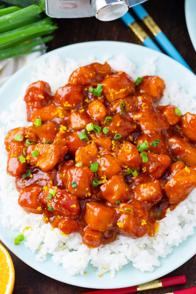 Overhead shot of homemade Instant Pot Orange Chicken over white rice.