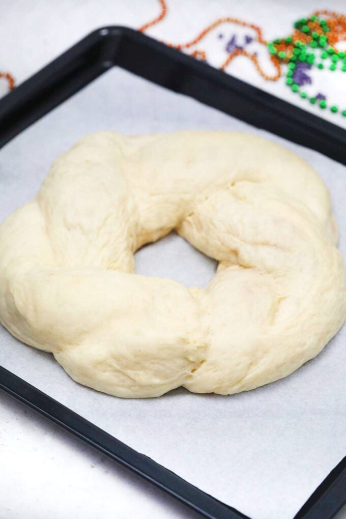 Mardi Gras King cake on a baking sheet.