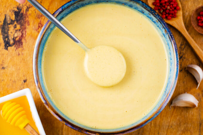 A bowl of honey mustard sauce.