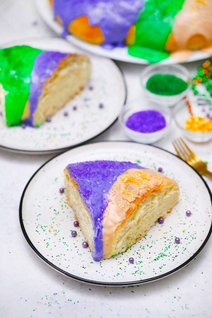 Mardi Gras King cake with purple, yellow, and green icing.