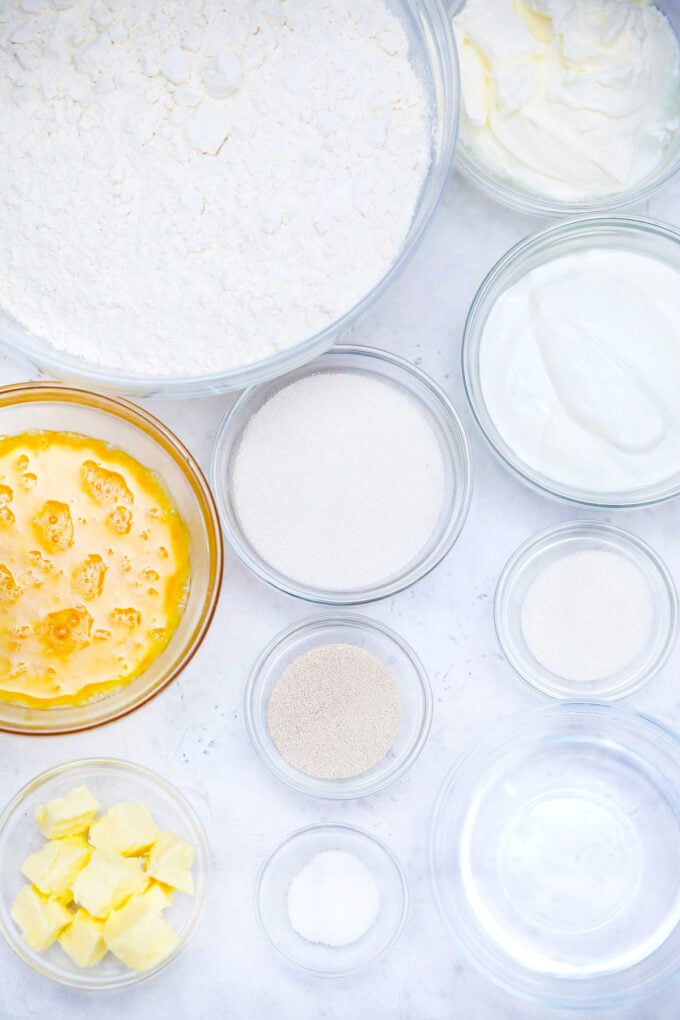 Overhead shot of Mardi Gras King cake ingredients in bowls.