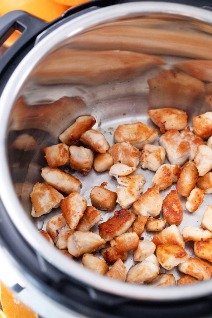Searing chicken pieces in the Instant Pot.
