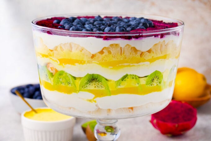 Mardi Gras trifle with layers of fruits in yellow, green, and purple.