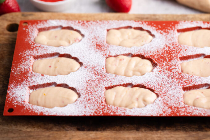 Strawberry madeleines in a madeleine tray.