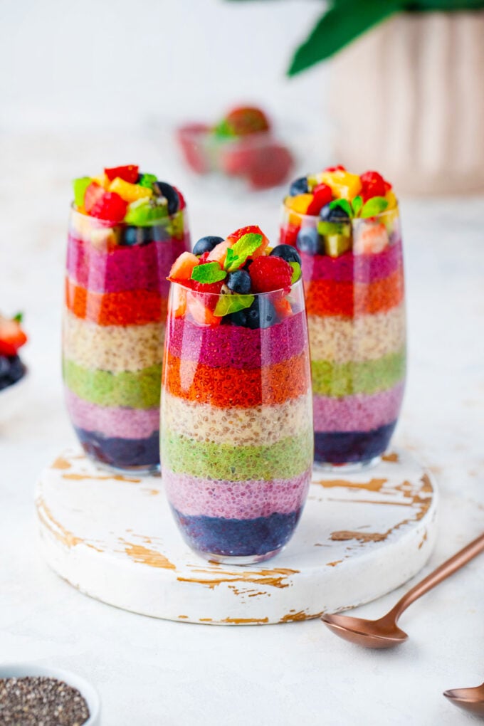 Three rainbow chia pudding parfaits.
