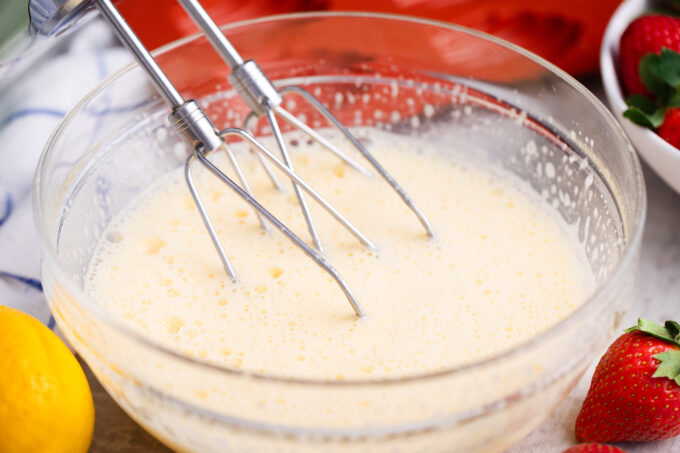 Whisking eggs and sugar.