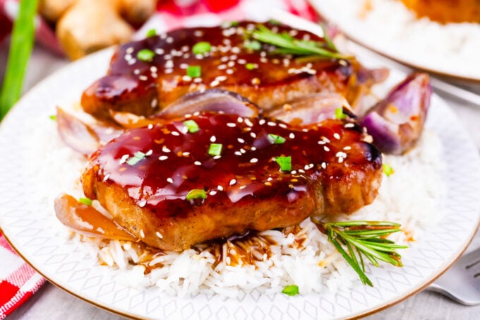 Homemade General Tso pork chops over white rice.