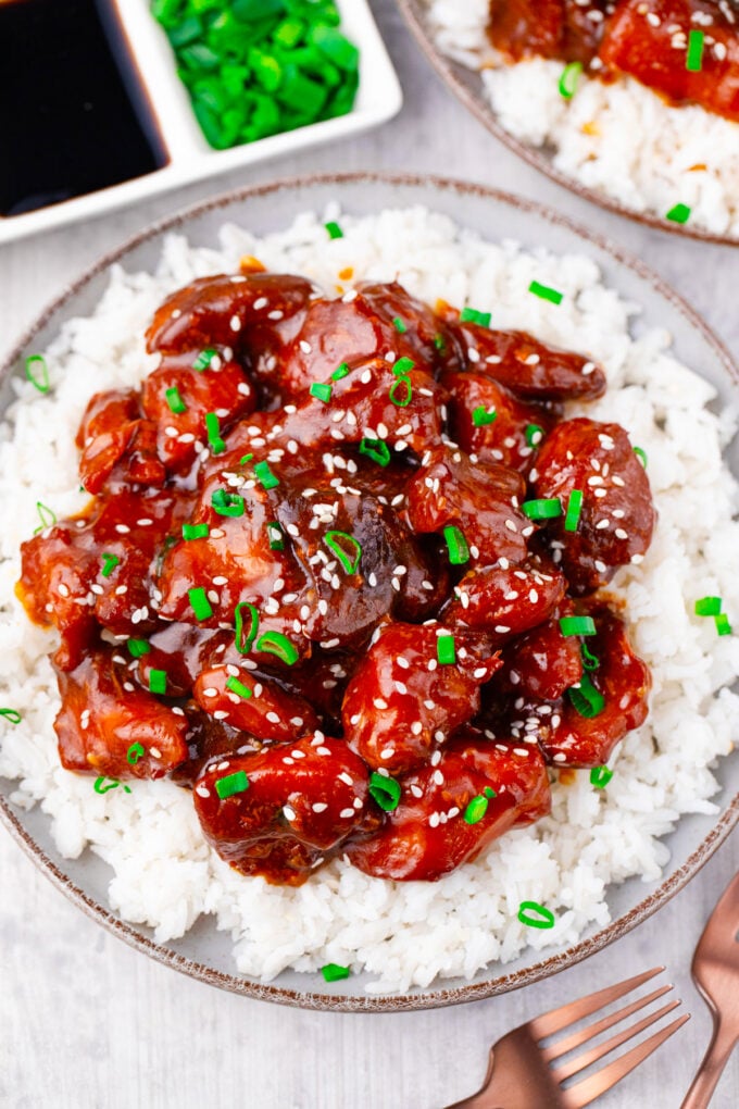 Overhead shot of slow cooker sesame chicken over rice.