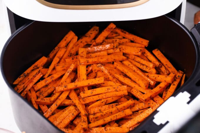 Air frying sweet potato fries.