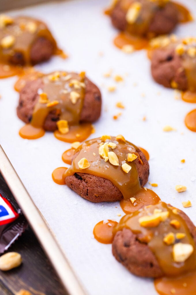Caramel snickers cookies with chopped peanuts.